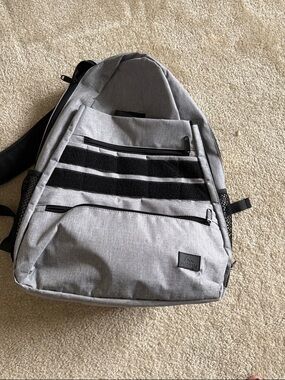 Gray tennis or racket ball backpack